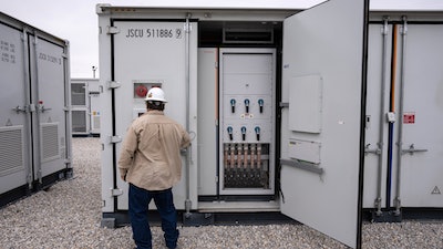 An employee works at a battery energy storage facility in Saginaw, Texas, April 25, 2023, that is owned and operated by Eolian L.P.