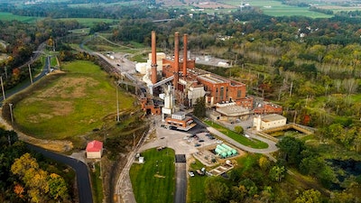 A brief patch of early morning sunlight brightens the landscape around the Greenidge Generation power plant, Oct. 15, 2021, in Dresden, N.Y. State officials on Thursday, June, 30, 2022, denied air permit renewals to a bitcoin-mining power plant in Finger Lakes that environmentalists called a threat to New York's climate goals.